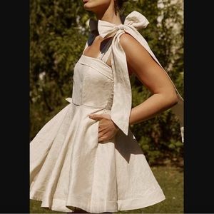 DISSH AISLE PEARL LINEN BOW MINI DRESS.